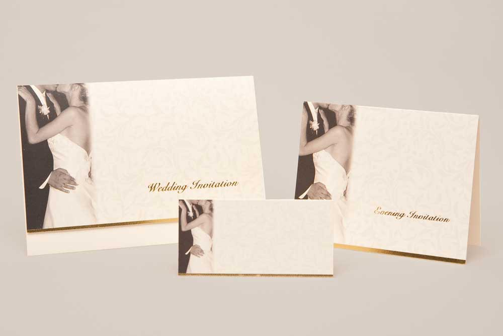 This is a 178mm x 127mm landscape shape ivory card. The cover of the card is finished with a flock design and a phototgraph of a bride and groom in sepia tones. The words 'Wedding Invitation' are printed on the card in gold foil. This card is completed with a reply card and wedding information card which can be used for directions or accommodation details and all items are included in the price of the day invitation. Accommodation or wedding information details must be supplied by email or word document. The recommended font for this design is CF12, however other options are available. You can choose your selected font below with each card that is available in the range. The recommended ink colour for this design is black, however other options are available. You can choose your selected font below with each card that is available in the range.